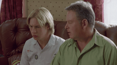 Man And Boy Sitting On Couch With 91 Button GIF