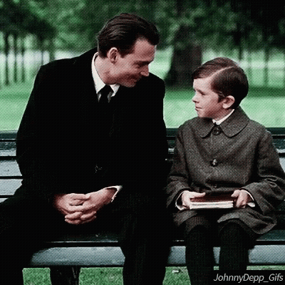 Man and Boy Talking on Bench