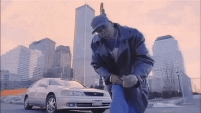 Man And Car At City Skyline GIF