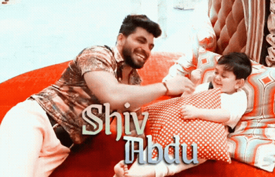 Man And Child Laying On Bed With Shiva GIF
