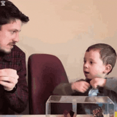 Man And Child Looking At Butterfly In Clear Container GIF