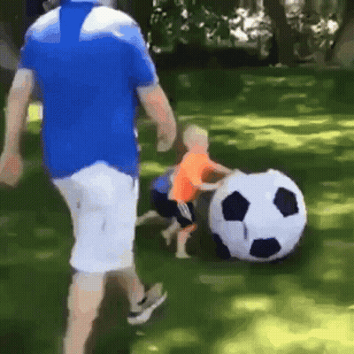 Man And Child Playing With Soccer Ball GIF