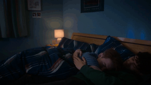 Man And Child Sleeping On Bed GIF