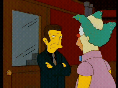 Man And Clown Standing In Front Of Window GIF