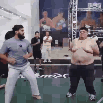 Man And Fat Man Dancing In Boxing Ring Saying Brand Risk GIF