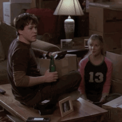 Man And Girl Sitting On Couch, Girl In Number 13 Shirt GIF