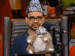 Man And His Puppet Wearing Tin Hat GIF