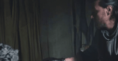 Man And Leopard Staring In Dark GIF
