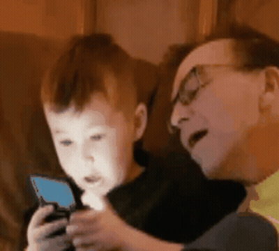 Man And Little Boy Playing With Cell Phone GIF