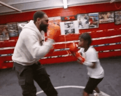 Man And Little Girl Boxing In Ring GIF