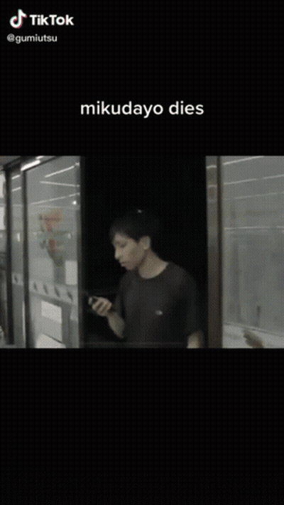 Man And Mikudayo Doll At 7-Eleven GIF