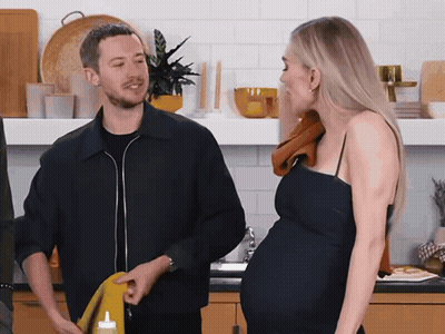 Man And Pregnant Woman In Kitchen GIF