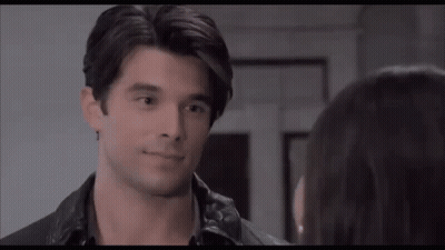 Man And Pregnant Woman Walking Down Stairs GIF