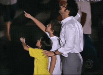 Man and Two Children Looking Up Made by Freemake.com