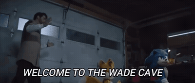 Man And Two Stuffed Animals In Garage Saying Welcome To The Wade Cave GIF