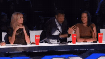 Man And Two Women At Microphones GIF