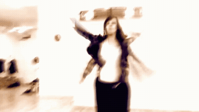 Man And Two Women Dancing In Room With Clock GIF