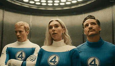 Man And Two Women In Fantastic Four Uniforms GIF