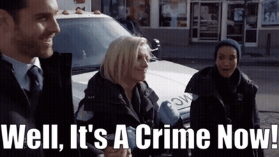 Man And Two Women In Front Of Police Car Saying Well It's A Crime Now GIF