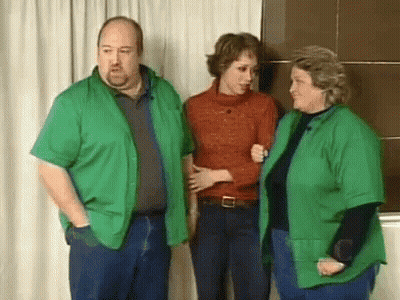 Man And Two Women In Green Shirts GIF