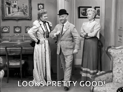 Man And Two Women In Living Room Looks Pretty Good GIF