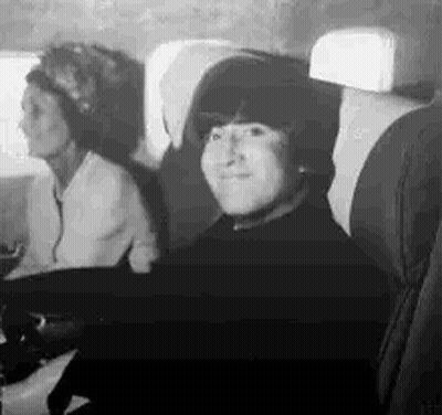 Man And Two Women On Plane Black And White GIF