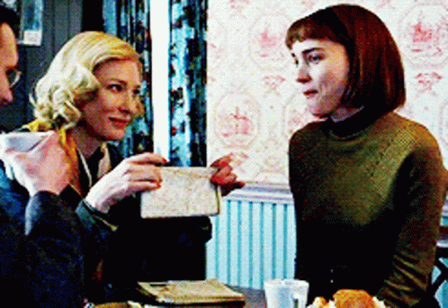 Man And Two Women Sitting At Table Having Conversation GIF