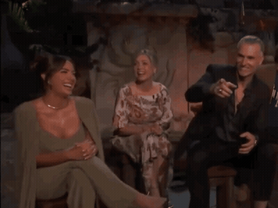 Man And Two Women Sitting On Chair Laughing GIF
