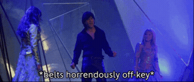 Man And Two Women Standing Belts Horrendously Off-Key GIF