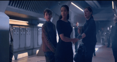 Man And Two Women Standing GIF