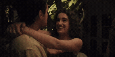 Man And Two Women Standing In Dark Room GIF