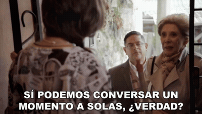 Man And Two Women Standing In Front Of A Door Saying Si Podemos Conversar Un Momento A Solas Verdad GIF