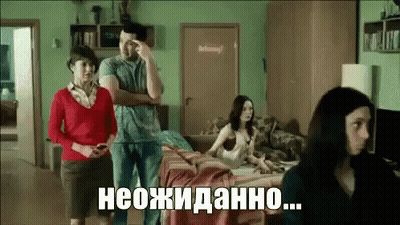 Man And Two Women Standing In Living Room With Woman On Couch GIF