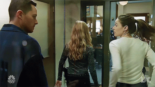 Man And Two Women Standing Next To Each Other GIF