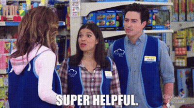 Man And Two Women Talking In Store GIF