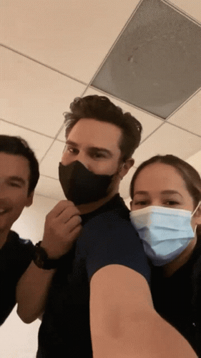 Man And Two Women Wearing Face Masks Posing GIF