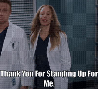 Man And Woman Applauding Before Crowd GIF