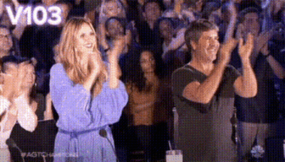 Man And Woman Applauding In Front Of Crowd GIF