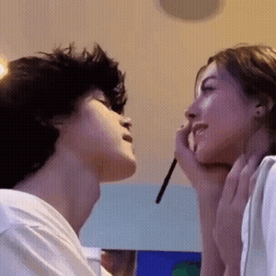 Man And Woman Applying Makeup To Each Other GIF