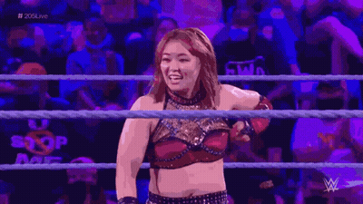 Man And Woman Arm Wrestling In Crowd With Number 4 GIF