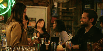 Man And Woman At Bar Under All Neon Sign GIF
