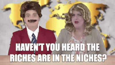 Man And Woman At Desk Haven't You Heard The Riches Are In The Niches GIF