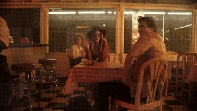 Man And Woman At Diner With Ice Cream Sign GIF