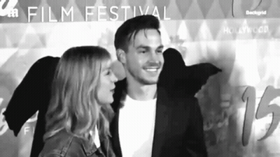 Man And Woman At Film Festival GIF