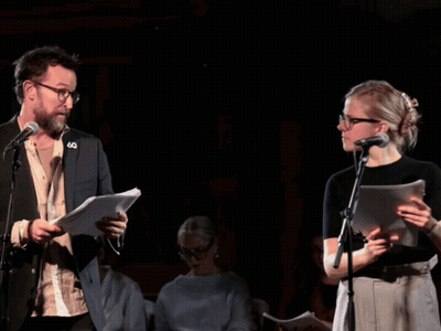 Man And Woman At Microphones With 60 Pin GIF
