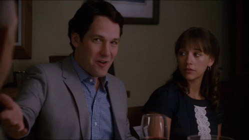 Man And Woman At Table Who Invited The Stand Up Comedian Over Here GIF