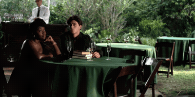 Man And Woman At Table With Green Tablecloth GIF