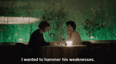 Man And Woman At Table With I Wanted To Hammer His Weaknesses GIF