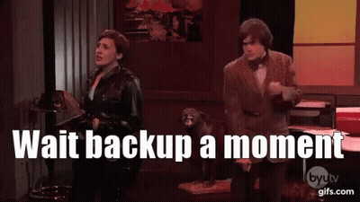 Man And Woman Beside Dog Saying Wait Backup A Moment GIF