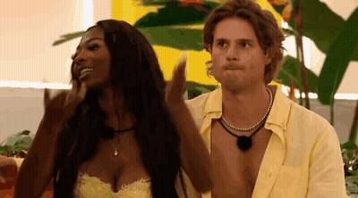 Man And Woman Beside Plant GIF